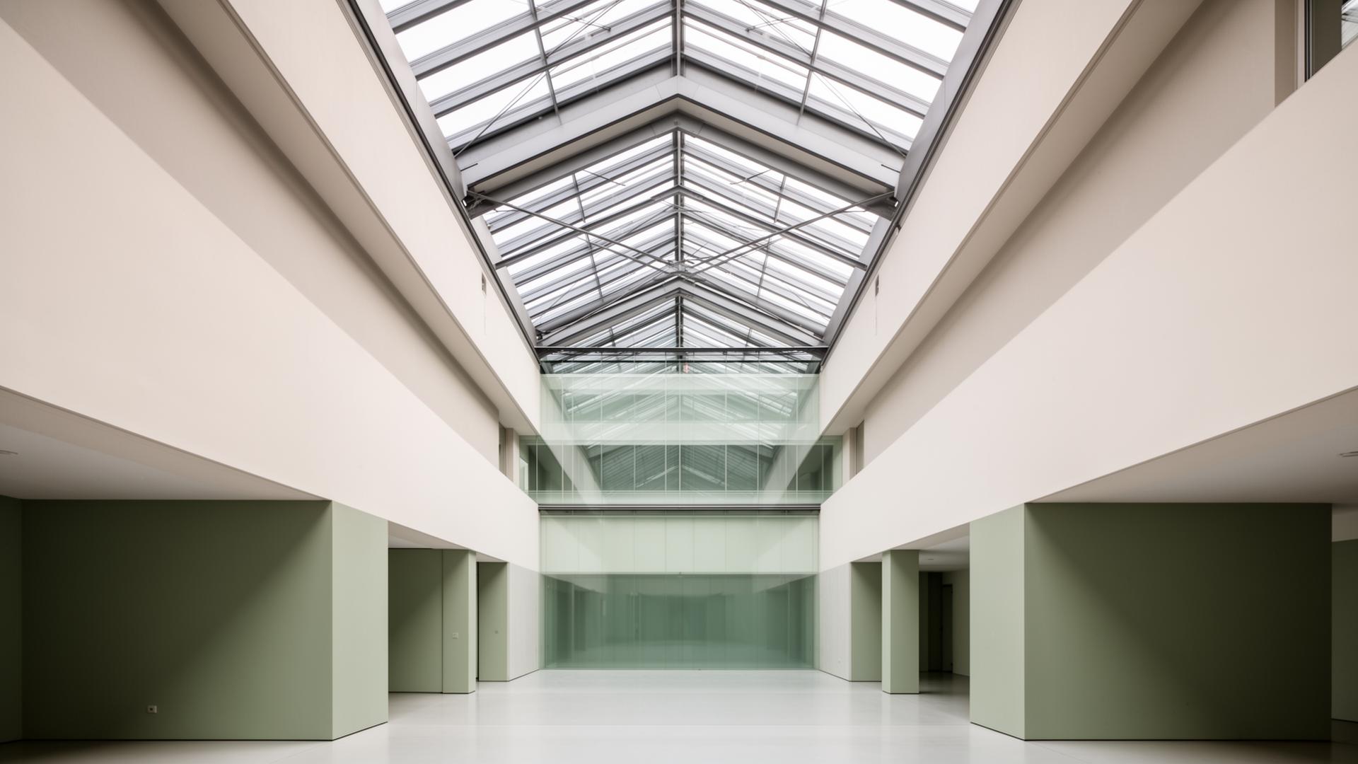 Abstract architectural interior — clean geometry, glass and steel, considered space.